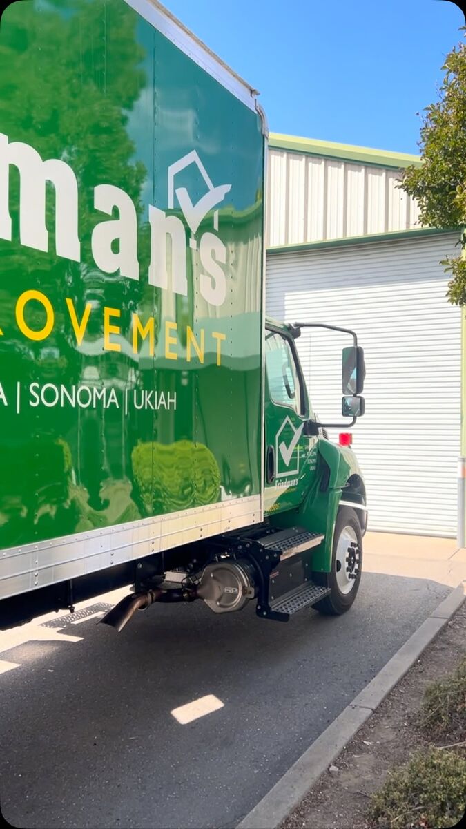 Green Friedman's Home Improvement box truck, the wordmark large across the box side with Santa Rosa, Sonoma and Ukiah listed under it