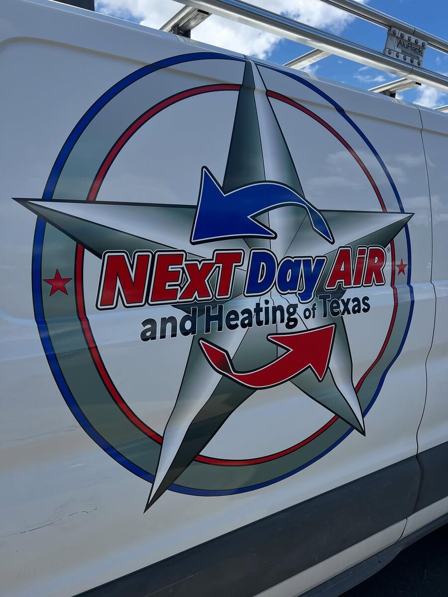 Next Day Air and Heating logo — a chrome star with red and blue arrows — printed and cut ready for installation