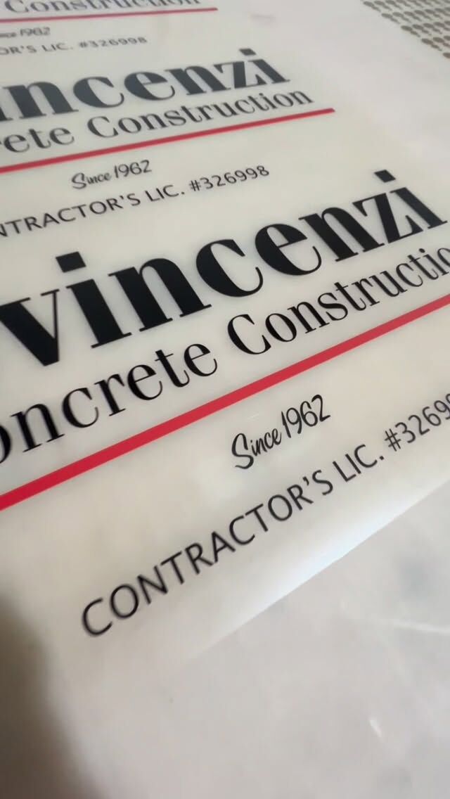 Vehicle door lettering reading Vincenzi Concrete Construction, Since 1962, with a contractor licence number beneath