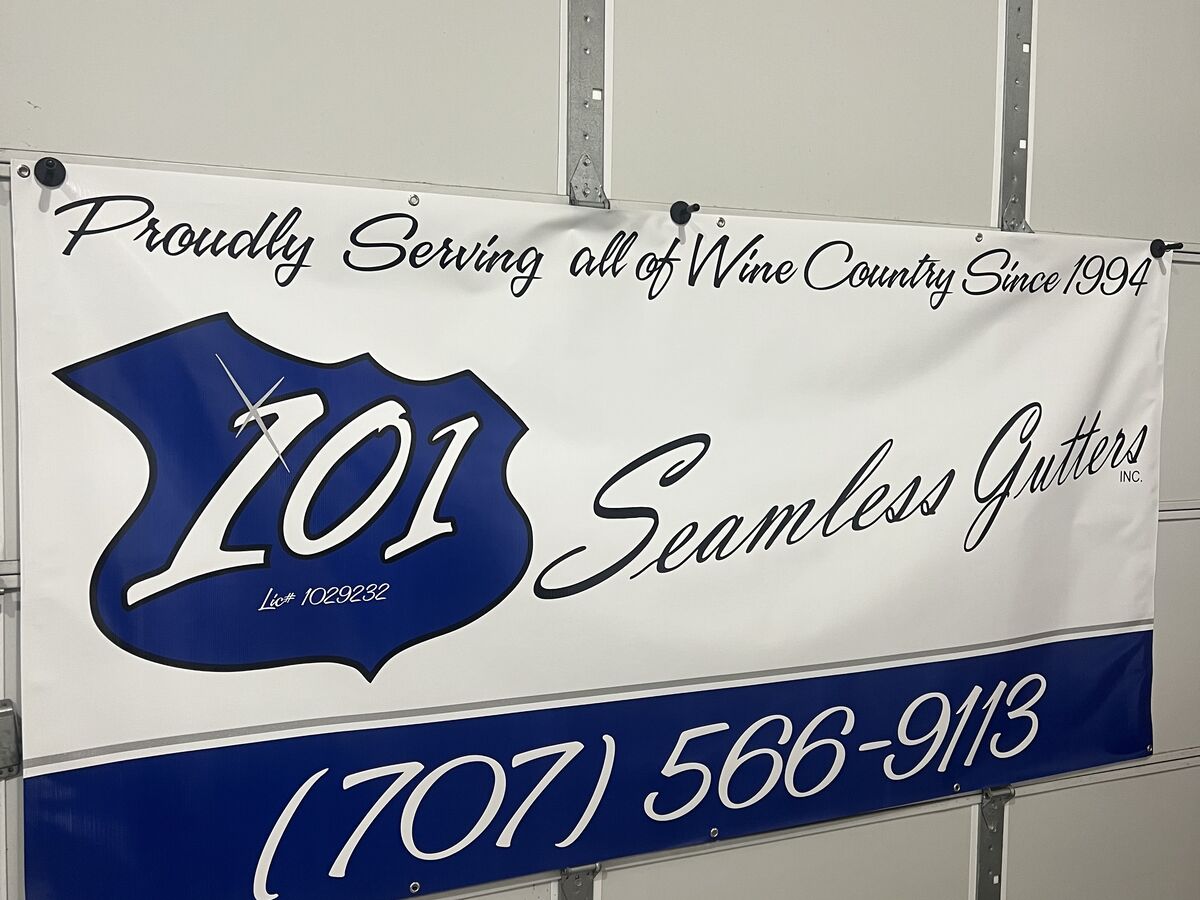 Vinyl banner for 101 Seamless Gutters — a blue highway-shield 101 mark, the script wordmark, the line Proudly Serving all of Wine Country Since 1994 and a phone number on a blue band