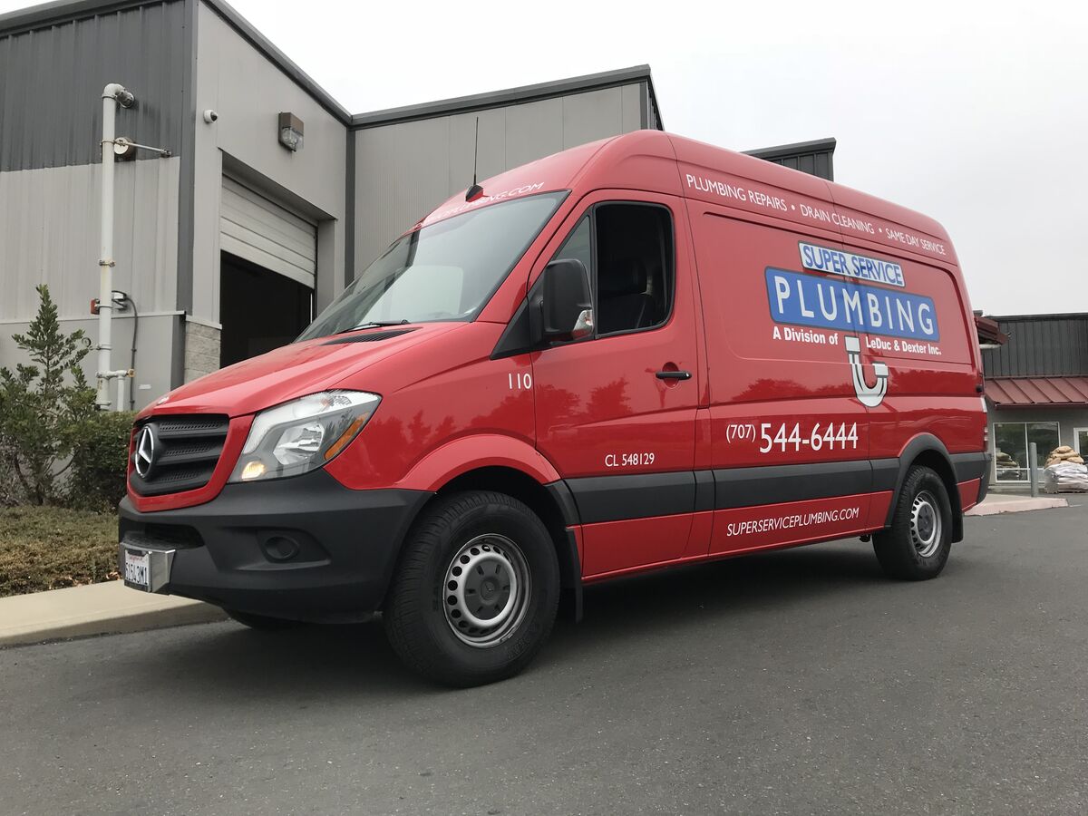Red Mercedes-Benz Sprinter van fully wrapped for Super Service Plumbing